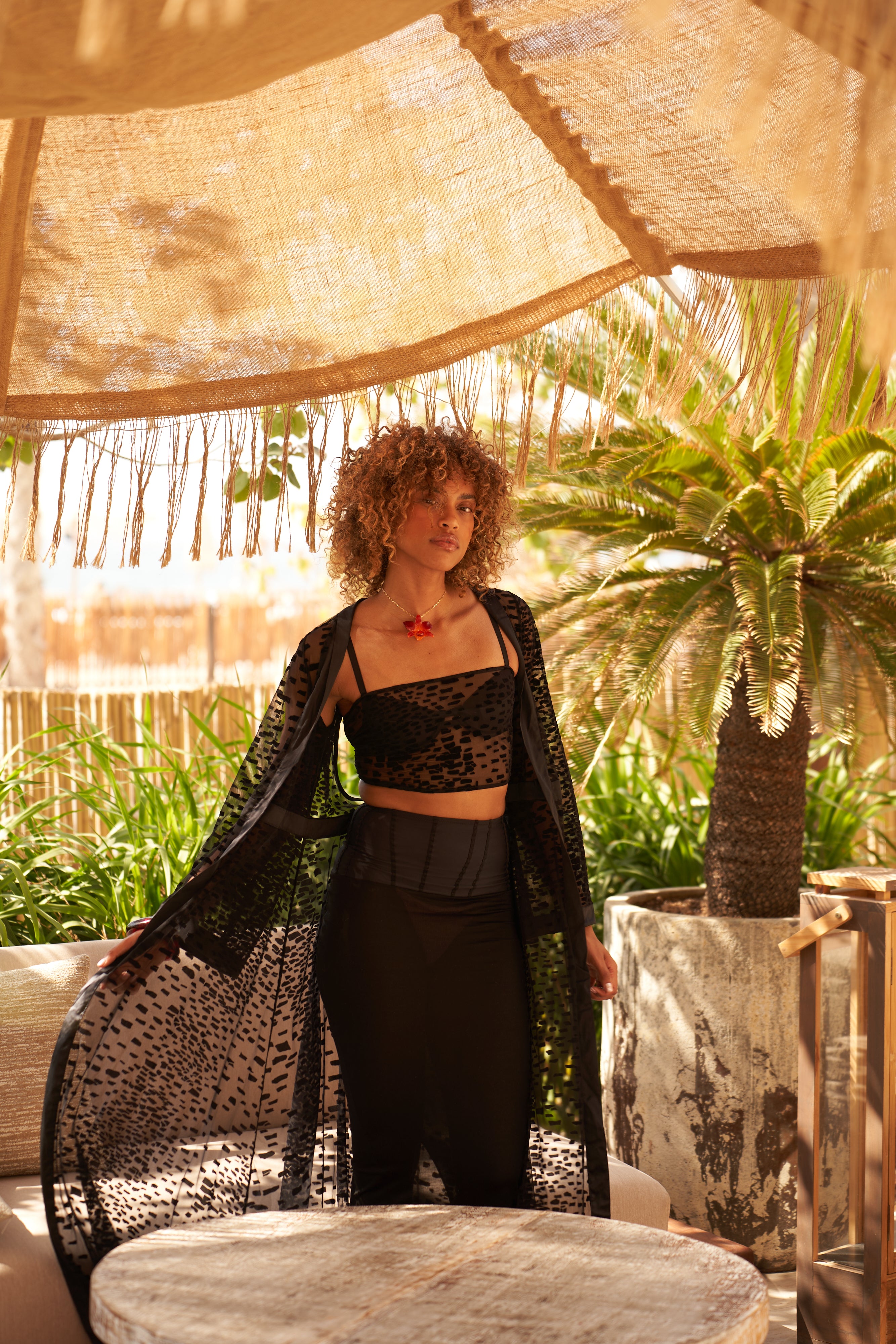Hanna Lhoumeau wearing the Lumey Paris 11.14 velvet flocked tulle kimono open over matching bra and 03.87 satin jersey skirt, Dubai beach