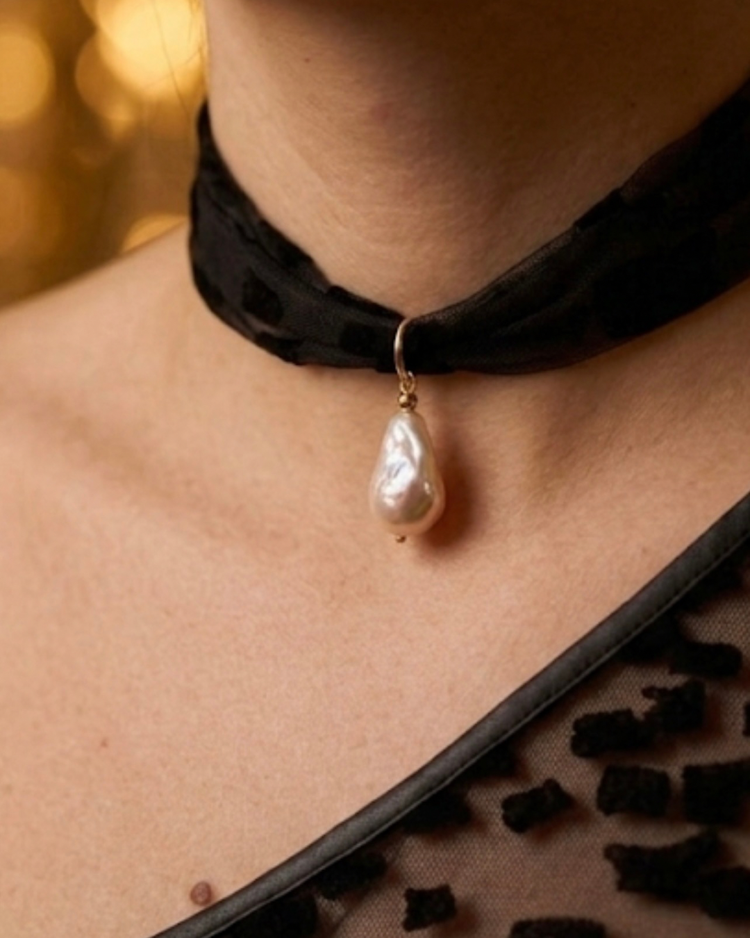 Lumey Paris x Farouche Tourny choker — black velvet flocked tulle band with baroque pearl pendant on gold-filled setting, worn around the neck
